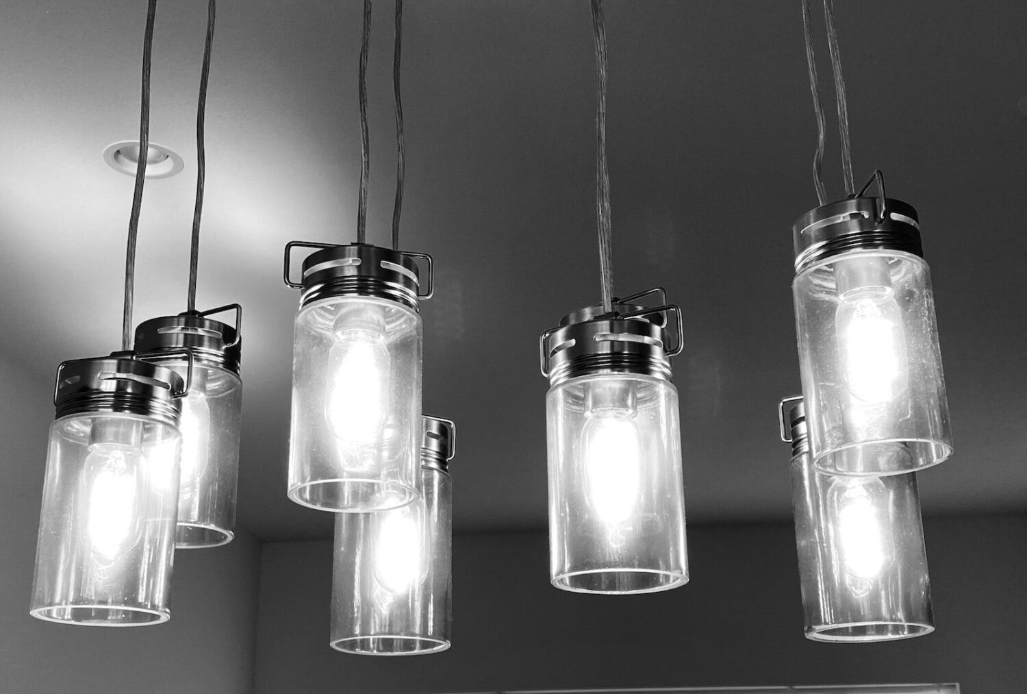 3 clear glass jars with white string lights